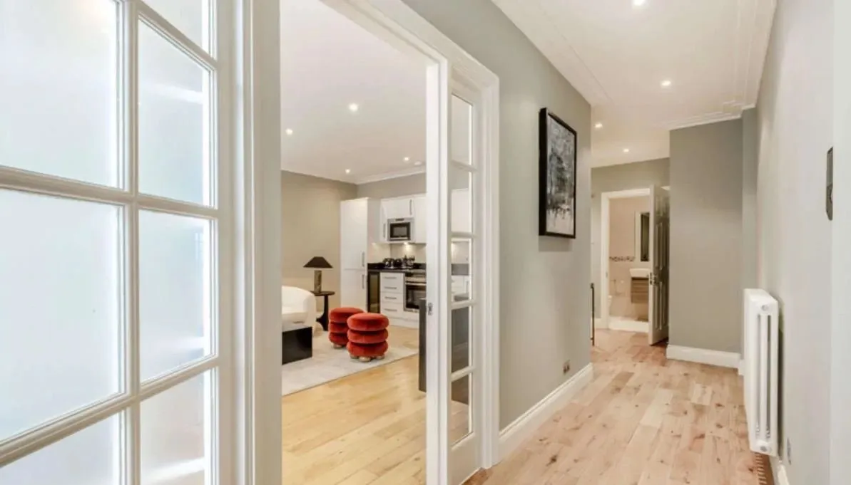 Luxury service apartment hallway with open living space